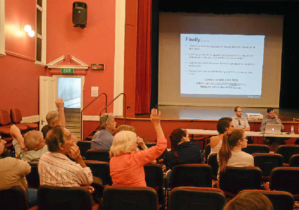 HANDS UP: Residents raise their concerns over the proposed Oman Ama nuclear waste site at Warwick Town Hall yesterday. HANDS UP: Residents raise their concerns over the proposed Oman Ama nuclear waste site at Warwick Town Hall yesterday.